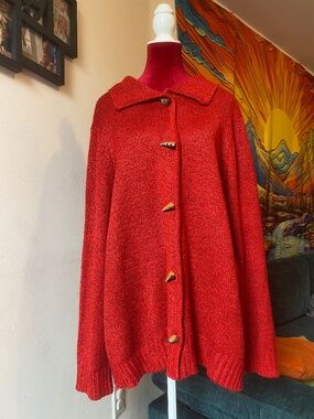 vintage-style red knit cardigan with a collar and toggle buttons